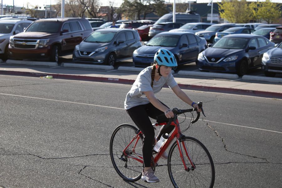 Chloe biking at the lobo triathlon
